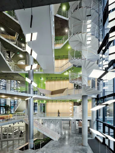 The atrium receives daylight through its glazed exterior walls and a modest skylight.