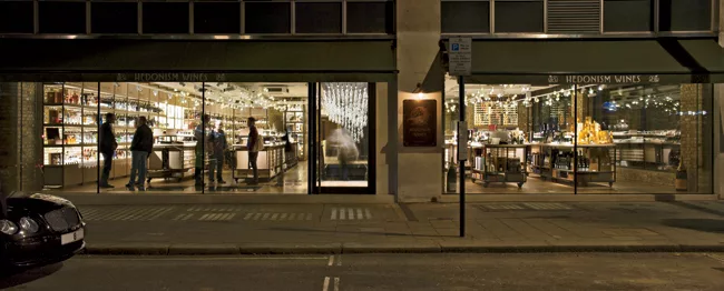 A fully glazed facade invites passersby to experience Hedonism Wines’ glittering effects.