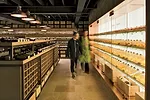 The cavelike lower level features a storage unit specially lit to highlight the shop&rsquo;s collection of vintage Ch&acirc;teau d&rsquo;Yquem.