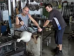 Glassblowers near Murano, Italy, work on early prototypes of the lamps.
