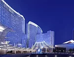 The hotel's entry has a sweeping laminated glass entry canopy that wraps around a drop-off circle.