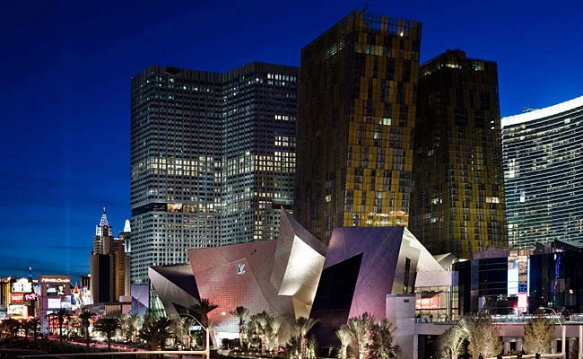 The stainless skin of Daniel Libeskind's Crystals retail complex reflects the color and light of the signage across the Strip.