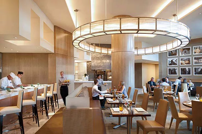 Tihany also designed the interior of the Mandarin's MOzen Restaurant. Here, the firm was striving to offer a neutral and calm environment. Beige tones and soft whites dominate, with sycamore wall pane