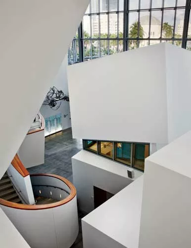 In the six-story atrium, Gehry stacked geometric forms for various functions. Most contain rehearsal rooms where viewers can glimpse musicians at work.