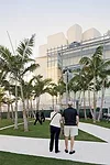 An 80-foot-high by 180-foot-long unitized aluminum glazing system with low-iron glass mounted on a secondary steel frame marks the front entrance. This curtain wall is repeated on the west elevation.