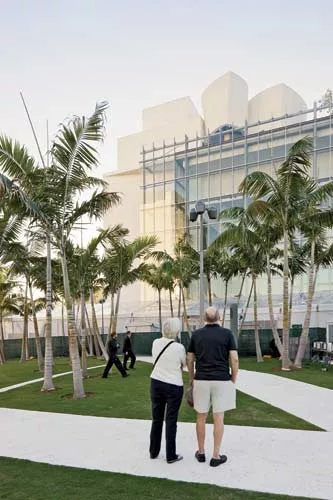 An 80-foot-high by 180-foot-long unitized aluminum glazing system with low-iron glass mounted on a secondary steel frame marks the front entrance. This curtain wall is repeated on the west elevation.