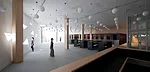 Tucked into the northwest corner of the addition, the library is the only space with columns and one of the few with generous glazing. A lower level provides more space for stacks.