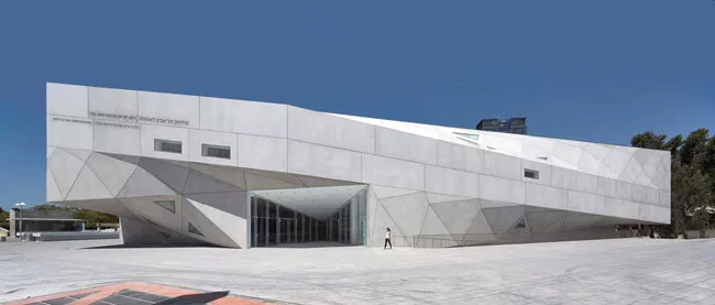 From the plaza, visitors enter the $55 million addition through doors tucked into its folded form