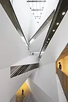The 87-foot-high void at the center of the Lightfall comes as a dramatic contrast to the building's low-slung appearance from the plaza. 
