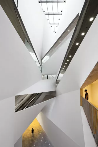 The 87-foot-high void at the center of the Lightfall comes as a dramatic contrast to the building's low-slung appearance from the plaza. 