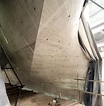 The concrete surface is left exposed on the gallery-facing elevations of the Lightfall, revealing the imprint of the formwork.