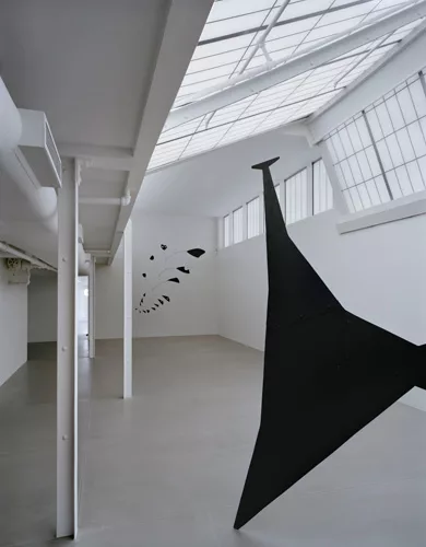 The first gallery has angled skylights, which give it the feeling of a Parisian garret.