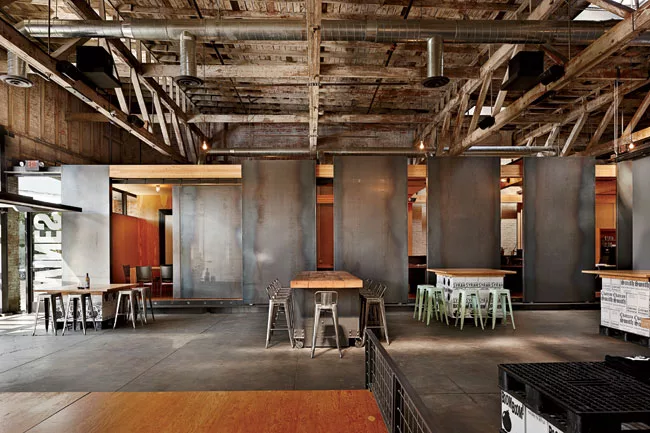 <strong>Open Office</strong> Steel panels slide to adjust the visibility of a workspace from a public tasting room and to regulate the amount of daylight coming in from existing skylights in the forme