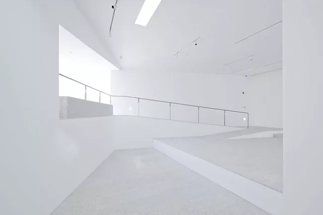 Ramps and steps help divide the sprawling galleries into distinct spaces for a diverse collection of art that had not been installed at the time these photographs were taken.
