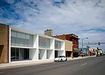 In homage to the original masonry, the brise-soleil’s powder-coated aluminum tubes, like standard brick, are 2 3/8 inches high.