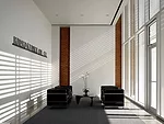 <strong>Community Lounge</strong> Just beyond the dramatic entry through the brise-soleil, the reception area provides a quiet pause before the procession down the central hall. The architect has left