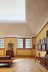 On the second floor, the architects have given gallery ceilings a very different treatment with cyma curve plaster moldings and clerestories of acid-etched glass.