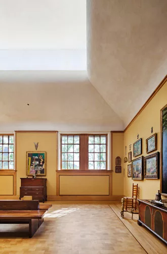 On the second floor, the architects have given gallery ceilings a very different treatment with cyma curve plaster moldings and clerestories of acid-etched glass.