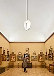 The shaped ceilings in ancillary first floor galleries echo the barrel vaults of the galleries in Merion.