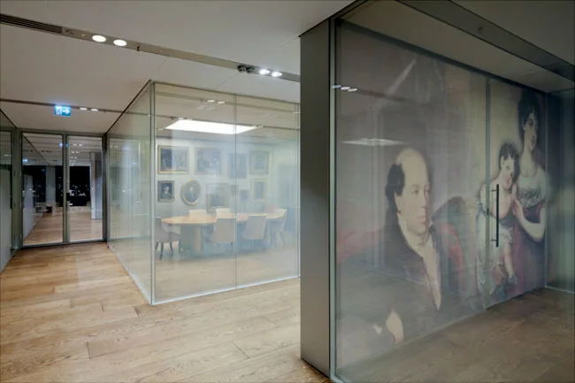 In a modern take on portraiture, large-scale depictions of members of the Rothschild family are printed onto silk scrims.