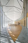 The 2,500-square-foot event atrium can hold 200 people and accommodate both talks and parties. Wood panels along the north side of the space were made from ginkgo trees that were cut down to make way 