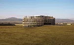 2,060-year-old battlefield On the site where Julius Caesar laid siege to Gallic leader Vercingetorix, Bernard Tschumi has created a circular concrete orientation center wrapped in a wood lattice.