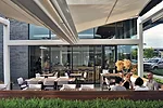 Patrons enjoy a meal at the outdoor dining area of Matthew Kenney, a raw whole-foods restaurant.