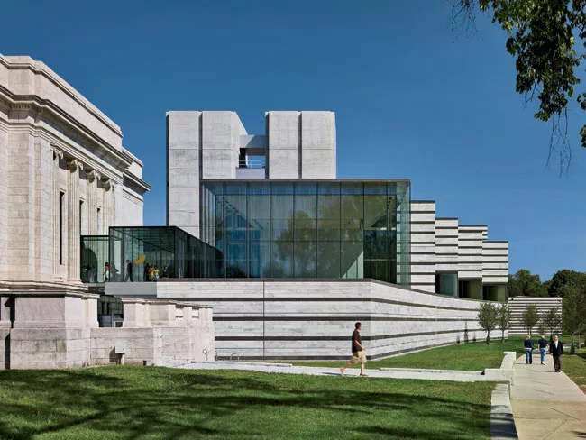 Rafael Vi'oly gave a nod to Breuer with his 2009 east-wing addition, clad in bands of granite and white marble.