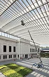 A 'hole' in the center of Vi'oly's plan was topped by an enormous glass roof, creating an atrium between the original museum building, Breuer's addition, and two news wings. It almost doubles the muse