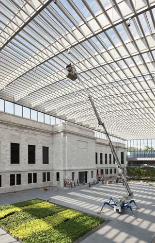 A 'hole' in the center of Vi'oly's plan was topped by an enormous glass roof, creating an atrium between the original museum building, Breuer's addition, and two news wings. It almost doubles the muse