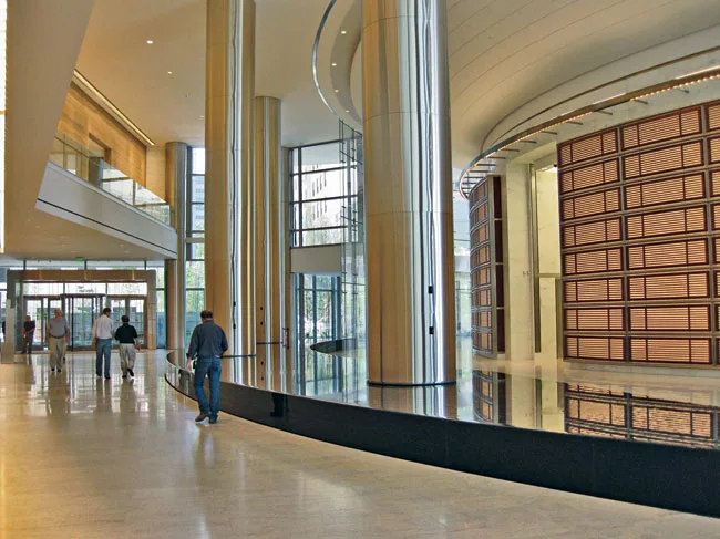 The elevator banks at the base of the tower employ lush finishes, such as sapele-wood screening and Calacatta Caldia white marble on the walls and Kashmir White granite on the floor.