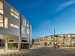 The first phase of Uptown was completed in August, comprising the Triangle, at left, and the Beach, at right. The two mixed-use structures sit across from each other on Euclid Avenue, providing studio