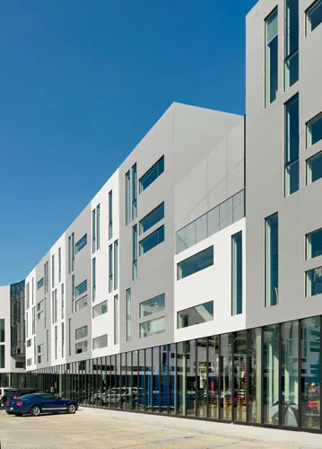 Parking for the ground-level amenities, like a Barnes & Noble and grocery store, is located behind the buildings.