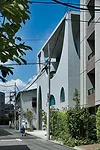Contrasting sharply with the low-scale apartment buildings and single-family homes nearby, the swooping arches'no two are the same'admit plenty of daylight and sky views while editing out the surround