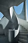 Contrasting sharply with the low-scale apartment buildings and single-family homes nearby, the swooping arches'no two are the same'admit plenty of daylight and sky views while editing out the surround