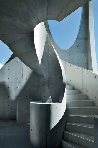 Contrasting sharply with the low-scale apartment buildings and single-family homes nearby, the swooping arches'no two are the same'admit plenty of daylight and sky views while editing out the surround