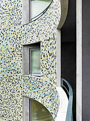 The architects were inspired by Antoni Gaud' more than by Finnish residential design; his integration of craft into his work is reflected in the facade's porcelain chips