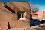  To improve the walls' durability, the client elected to incorporate elements such as metal caps on the roof parapets and flagstone splash blocks at the base of the walls under the <em>canales</em