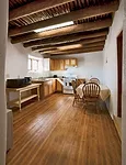 Inside the houses, the project team restored the ceiling <em>vigas</em> (roughly dressed logs) and <em>latias</em> (small-diameter wood poles) wherever it could.