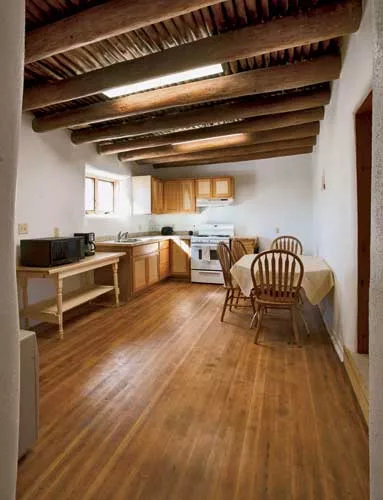 Inside the houses, the project team restored the ceiling <em>vigas</em> (roughly dressed logs) and <em>latias</em> (small-diameter wood poles) wherever it could.