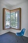 Calibrated for sun angles, the external window hoods, made of powder-coated aluminum, allow for large and varied apertures'opening the interior to light and views while diminishing heat gain. Interior