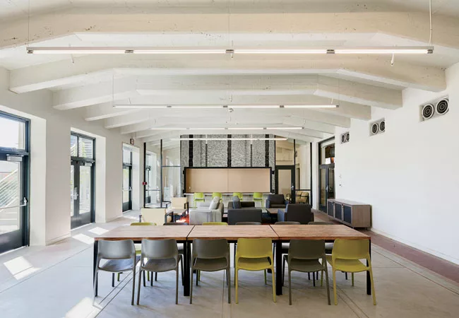 In the former pool area, Newsom Design’s black-and-white photomural evokes water.