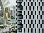 The towers' extra wide exterior halls are visible through vertical apertures.