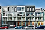The sustainable complex presents a discreet but welcoming face to the street with a community day-care center next to the entrance gate.
