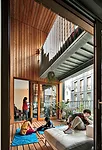 Almost every unit opens to a comfortable loggia surfaced with wood and enclosed by operable folding window walls that protect occupants from inclement weather and neighboring sounds.