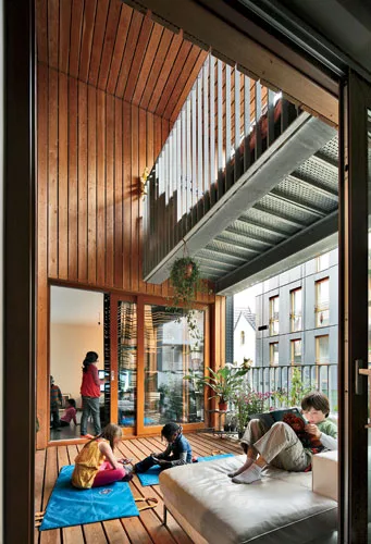 Almost every unit opens to a comfortable loggia surfaced with wood and enclosed by operable folding window walls that protect occupants from inclement weather and neighboring sounds.