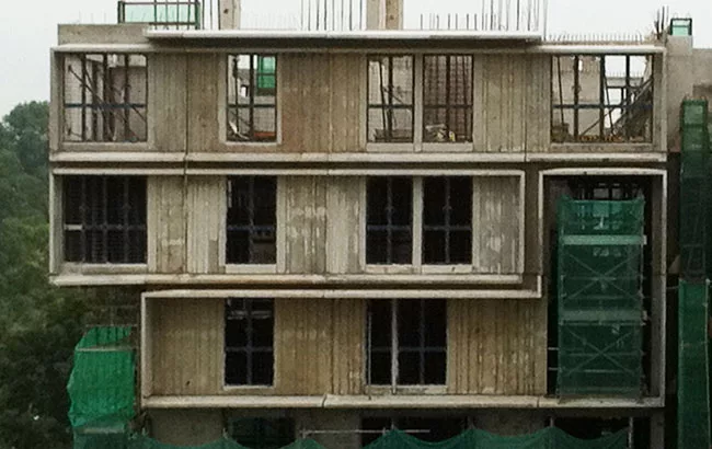 Stacked units under construction.