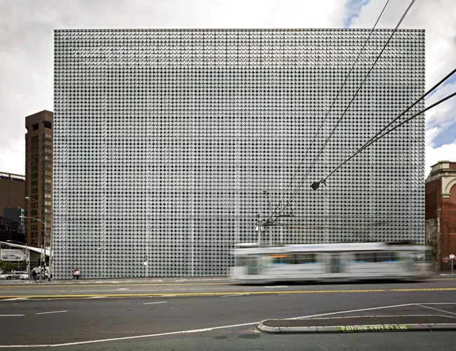  The 2-foot-diameter glass discs covering the building rotate to shade interiors and provide an animated skin that captures and reflects light in different ways.
