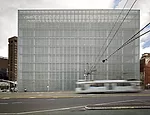  The 2-foot-diameter glass discs covering the building rotate to shade interiors and provide an animated skin that captures and reflects light in different ways.