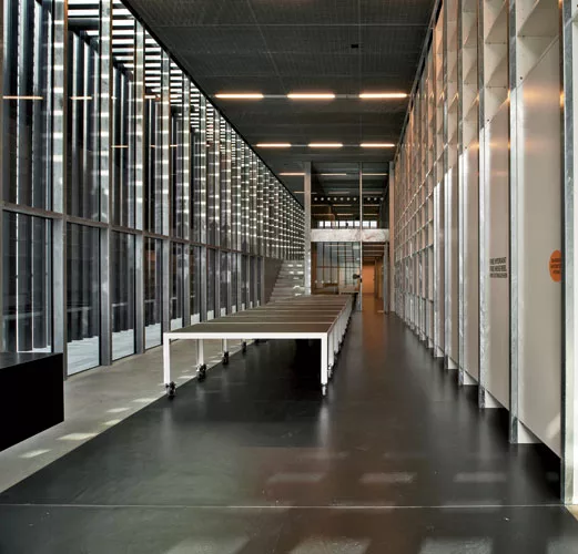 The lower building serves as the Design Hub's archives and has spaces for books, lectures, and exhibitions.